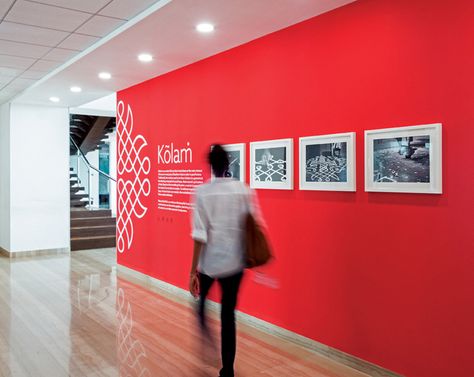 All The Wall Graphics In This Office Were Inspired By Indian Folk Art Cool Corporate Office Design, Corporate Wall Art, Red Office Decor Ideas, Office Branding Ideas, Red Wall Design, Office Branding Wall, Office Graphic Design, Wall Branding, Office Wall Graphics