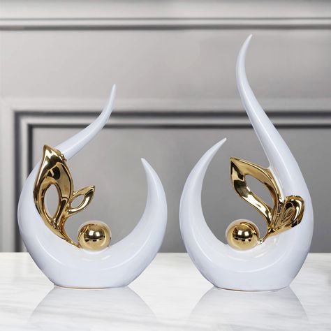 PRICES MAY VARY. Modern Abstract Art Decor size 9.8"H x 5"L x 2.5"W. Small Ceramic Statue 8" high x 6" long x 2.5" wide.Can blend perfectly with most living room decor.Ceramic sculpture can be a perfect art piece for dining room or living room or office decor, coffee table decor [HOME DECOR AESTHETIC]White and Gold Decor made of ceramic material, is an eye-catching piece. After being electroplated and polished, it shows off a mirror-like effect that will never fade [A GIFT EVERYONE LOVES] modern Table Decorations For Living Room, Show Pieces For Living Room, Show Piece Ideas For Home, Gold Living Room Decor Ideas, White Gold Home Decor, White And Gold Home Decor, Shelf Dining Room, Center Piece For Dining Table, Black And Gold Living Room