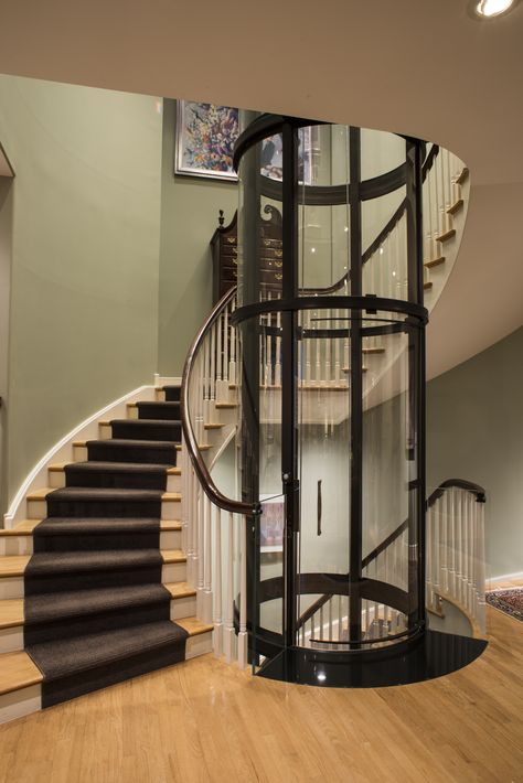 Spiral staircase with 3 stop round Vuelift home elevator Accessibility Architecture, Round Stairs, Stair Elevator, Chicago Luxury, Home Elevator, Stair Plan, Lift Lobby, House Lift, Circular Stairs