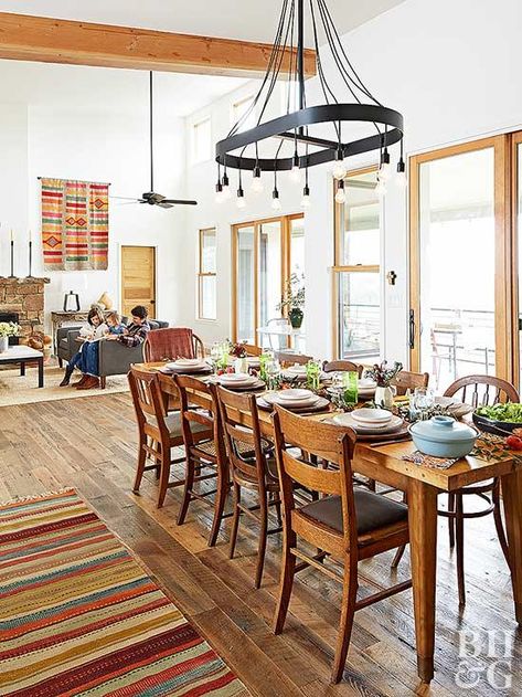 No matter the meal, a Southwestern-inspired dining room is guaranteed to please. Strong woodwork, iron accents, and a collection of colorful textiles keep this space modern and fresh. A wall of sliding doors ensures there's always plenty of light. Southwest Dining Room, Southwestern Furniture, Living Room Aesthetics, Patterned Furniture, Neutral Furniture, Southwestern Home, Room Aesthetics, Southwest Decor, Tuscan Decorating