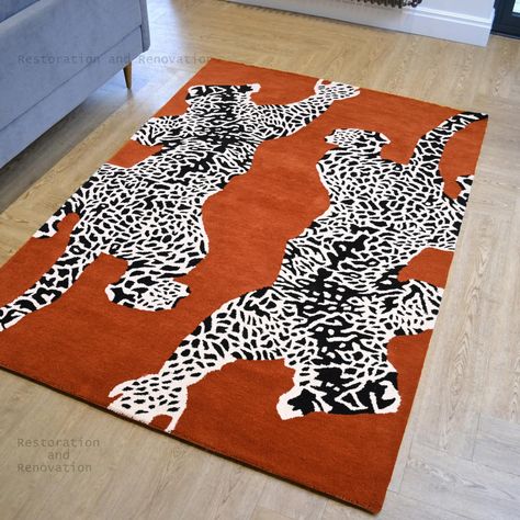 PRICES MAY VARY. 100% WOOL RUG: Indulge in the exceptional quality of our rug, crafted from 100% Premium Wool, for its ultimate comfort and superior durability. Perfect for high-traffic areas in your home. UNIQUE JAGUAR DESIGN: Our unique, black and white Jaguar animal print design adds a stylish touch to any room. This statement piece effortlessly enhances modern, contemporary, and bohemian home décor styles. HANDMADE INDIAN CRAFTSMANSHIP: Our rugs are handmade by skilled artisans in INDIA, ens Leopard Rug Living Room, Bohemian Maximalist Decor, Dining Room Dark, 90s Interior Design, White Jaguar, Jaguar Design, 90s Interior, Dark Dining Room, Leopard Rug