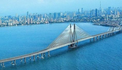 The Bandra–Worli Sea Link, officially called Rajiv Gandhi Sea Link, is a cable-stayed bridge with pre-stressed concrete steel viaducts on either side that links Bandra in the Western Suburbs of Mumbai with Worli in South Mumbai. Nariman Point, Mumbai Skyline, Bandra Worli Sea Link, Cable Stayed Bridge, Mumbai City, Mumbai India, Dream City, Tourist Places, South India