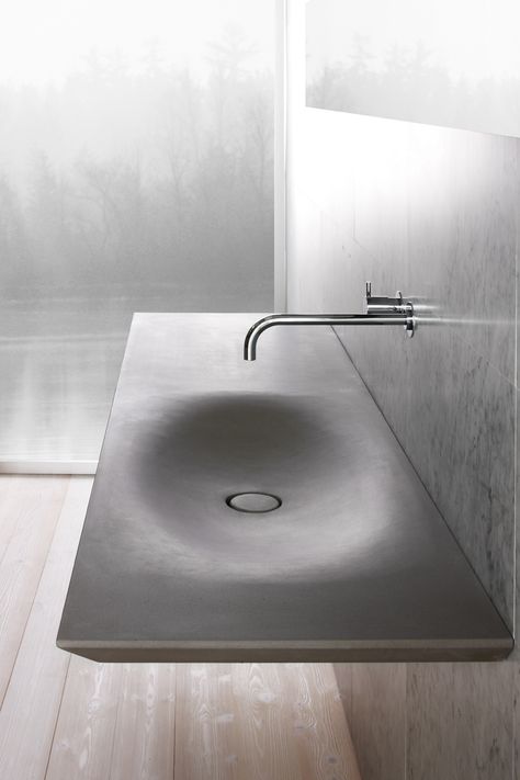 This modern sink has all of the benefits of an integrated sink as well as the benefits of having grey stone countertops, including durability. Drømme Bad, Modern Sink, Concrete Sink, Futuristic Interior, Sink Design, Bad Design, Minimalist Bathroom, Bathroom Inspiration, 인테리어 디자인