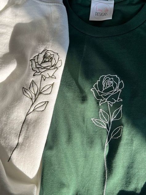 Organic Single Rose T-shirt - Embroidered Designs - Hand Drawn Rose - Sustainable Clothing - Soft Unique Top T shirt #tshirt t-shirt #t_shirt t shirts #tshirts t-shirts #t_shirts T shirt design #tshirtdesign T-shirt designs #t_shirtdesign T shirts designs #tshirtsdesigns 6.211 Red Shirt Embroidery, Cute Shirt Designs Drawing, Embroidery On Shirts Diy, Black Flower Embroidery, White Rose Embroidery, Drawing On T Shirt, Unique Embroidery Designs Ideas, Cute Hand Embroidery Designs, Embroidery On Tshirt Ideas