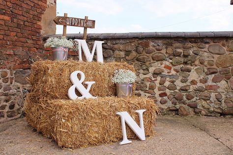 Straw Bale welcome set up for farm / barn wedding with large monogram letters, babies breath (gypsophila) and wooden directional wedding signage. Hay Bails For Wedding Seating, Straw Bales Wedding, Hay Bail Wedding, Hay Bale Seating Wedding, Hunting Wedding Theme, Hay Wedding, Hay Bale Wedding, Farm Wedding Decorations, Hay Bale Seating