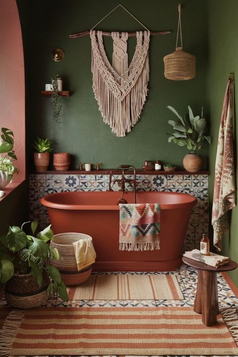 Bohemian bathroom featuring deep green walls, terracotta accents, patterned tiles, and a freestanding bathtub. Bathroom Bohemian Style, Green Color Scheme Bathroom, Boho Bathroom Green, Small Earthy Bathroom Ideas, Cozy Eclectic Bathroom, Dark Green And Terracotta Bathroom, Mid Century Boho Bathroom, Boho Green Bathroom, Green And Amber Bathroom