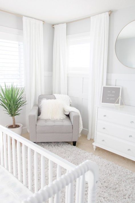 White and Grey Gender-Neutral Nursery, White and Gray Gender-Neutral Nursery with white drapes, soft gray feeding chair and gold accents Gray Gender Neutral Nursery, Nursery Chandelier, Baby Room Boy, Fresh Laundry, White Crib, Nursery Room Design, White Drapes, White Dining Room, Grey Nursery