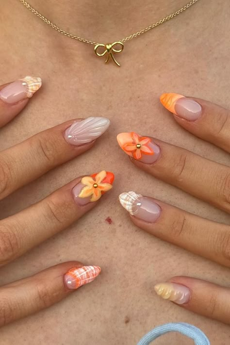 Looking for trending new nail designs to try out? 3D flower nails are where it's at right now with their insanely gorgeous designs. These tropical nail designs will have your jaw on the ground! Lowkey the perfect vacation nail ideas to try out. Orange Seashell Nails, Trendy Summer Nails 2024, Warm Nails, Summer Orange Nails, Orange Nails Ideas, Summer Nails Orange, Orange Summer Nails, Detailed Nails, Vacation Nail Ideas