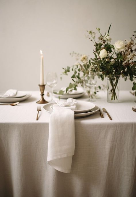 Create the perfect ambiance for an elegant wedding with a beautifully set table featuring a linen tablecloth. The soft and luxurious texture of the linen adds a touch of sophistication to the overall decor. Pair it with delicate china, sparkling glassware, and polished silverware to create a stunning tablescape. The neutral color of the linen allows for endless possibilities when it comes to floral arrangements and centerpiece designs. Tablecloth Inspiration, Gray Tablecloth, Linen Table Settings, Farmhouse Tablecloth, Floral Table Setting, Green Tablescape, Natural Farmhouse, Elegant Backdrop, Dining Table Cloth