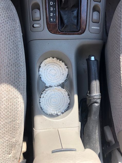 These coasters are super cute for your car cup holder They add a little pop to your car ☺️ Audi Car Decor, Neutral Car Decor, White Car Interior Decor, Audi Car Accessories, Macrame Car Decor, Car Accessories Boho, Tan Interior Car Decor, Macrame Cup Holder, Teen Car Accessories