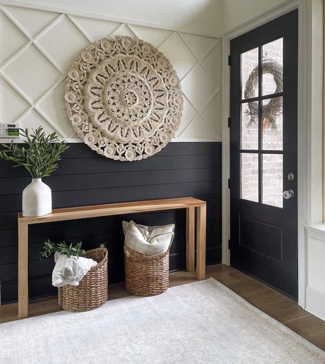 Greeted by a striking black entrance door, this farmhouse-styled entryway draws attention with its bold black-and-white shiplap design. An artfully hung large woven circular artwork rests above the wooden table with plants and woven baskets. Entryway Wall, Entry Way Design, Home Entrance Decor, Decoration Inspiration, Updating House, Decor Home Living Room, House Entrance, Front Room, New Wall