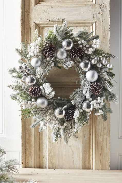 frosted pine wreath with shiny and matte silver balls, frosted pinecones and white berry picks Decorate Christmas Wreath, Christmas Wreaths White, Silver Wreath Christmas, White Christmas Wreath Ideas, White Pinecone Wreath, Silver Christmas Wreaths, Christmas Wreaths Silver, White And Silver Christmas Wreath, Silver Wreaths