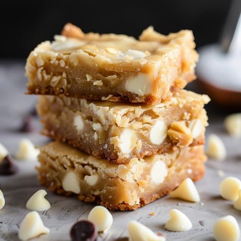 Calling all chewy cookie lovers! These white chocolate blondies are a dream come true. They're sweet, simple, and jam-packed with creamy chocolate chips. White Chocolate Chips Recipes, Chocolate Blondies, White Chocolate Blondies, Blueberry Breakfast Cake, Chocolate Chip Blondies, White Chocolate Bar, White Chocolate Chip, Blueberry Breakfast, Chocolate Chip Recipes