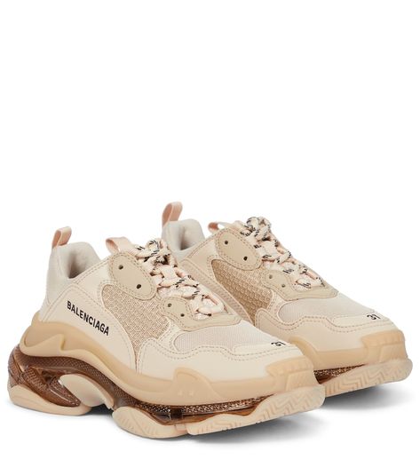 There’s something about Balenciaga’s Triple S sneakers that hits a contemporary nerve. From its chunky 6.5mm soles that seamlessly blend track, running and basketball cues in one style, to its leather-free composition and overt (we want to say deconstructive) display of the sizing at the toes, the original dad sneaker – here updated in beige – continues to keep us treading on a higher plane of cool. Balenciaga Triple S Outfit, Triple S Outfit, Balenciaga Triple S Sneakers, Brown Trainers, Nude Sneakers, Balenciaga Shoes Sneakers, Beige Sneakers, Streetwear Shoes, Balenciaga Sneakers