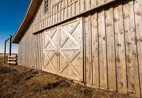 Post and beam barn with board and batten siding. Wood Look Steel Siding, Barn Siding Exterior, Barn Exterior Ideas, Barn Exterior, Exterior Barn Doors, Barn Remodel, Tractor Barn, Barndominium House, Board And Batten Exterior