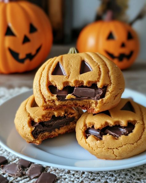 🎃 Milk Chocolate Stuffed Jack-O-Lantern Cookies 🍫 These festive cookies are filled with milk chocolate and shaped like spooky Jack-O-Lanterns! Ingredients: 2 1/2 cups all-purpose flour 1/2 teaspoon baking powder 1/4 teaspoon salt 1 cup unsalted butter, softened 3/4 cup granulated sugar 1 large egg 1 teaspoon vanilla extract Orange food coloring (optional) 12 milk chocolate squares or chocolate chips for stuffing Black icing (for decorating) Instructions: Preheat Oven: Preheat your oven to... Chocolate Chip Orange Cookies, Butter Cookies Decoration, Milk Chocolate Stuffed Jack O Lantern Cookies, Easy Fall Party Food, Fall Party Food Ideas, Jack O Lantern Cookies, Black Icing, Milk Chocolate Recipes, Fall Party Food