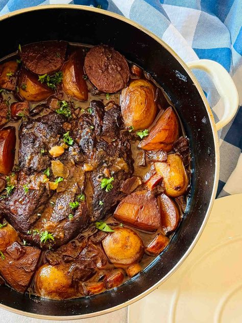 Braised chuckled roast in Dutch oven surrounded by vegetables and rich red wine and beef stock reduction. Chuck Roast Recipes In Dutch Oven, Beef Chuck Pot Roast Recipes Dutch Oven, Braised Chuck Roast Dutch Ovens, Chuck Roast Recipe Oven, Chuck Roast In Oven, Braised Chuck Roast, Cross Rib Roast, Chuck Roast Recipe, Dutch Oven Pot Roast