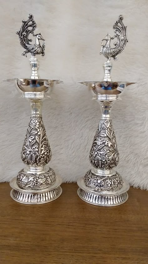 Mahalaxmi gold and diamond merchants 92.5 Silver Antique peacock 🦚 kuthu vilakku Grams - 958.570 Worldwide shipping available Customer care number - 9283 916 916 Silver Kuthu Vilakku Design, Silver Deepam, Silver Lamps, Silver Home Accessories, Silver Articles, Emerald Stone Rings, Golden Sparkle, Pooja Items, Pooja Mandir