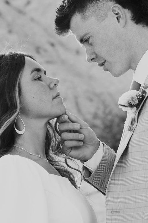 A groom tilts his fiancées chin up as he leans in to kiss her. Photo by Poise & Ivy Imagery Hold Face Couple, Hand Holding Chin Up Reference, Finger Under Chin Reference, Tilting Chin Up With Hand, Chin Tilted Up Reference, Tilting Someones Chin Up Reference, Holding Chin Pose Reference, Hands On Chest Couple, Hand Grabbing Chin Reference