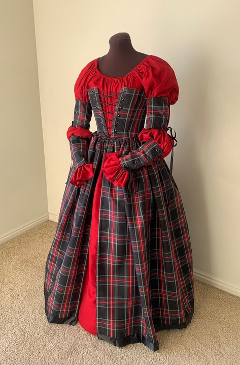 This is gown is ready  made and will be the merriest gown at this seasons' festivals!! The fabric is a medium weight woven plaid. The black Stewart plaid is black and green, with stripes of light blue, red and gold, The corset style bodice is fully lined and interlined, and boned at 9 intervals around the bodice, and double boned along the front closure of 14 black grommets.  The gathered overskirt is firmly attached to the bodice and is split down center front.  The bodice measurements are: 30 Plaid Dress Outfit Winter, Harlequin Fashion, Victorian Christmas Dress, Tartan Wedding Dress, Dickens Dress, Plaid Corset, Stewart Plaid, Irish Dress, Stewart Tartan