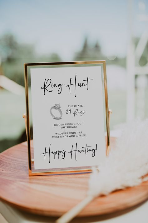 Ring Hunt Bridal Shower Games Instant Download, Ring Hunt Printable Sign, Minimalist Ring Hunt Modern Sign, Editable Fun Bridal Shower Game Please read before ordering! :) What Game is included in this listing: *Ring Hunt Game Sign (5x7 Size) MATCHING GAME BUNDLE HERE: https://www.etsy.com/listing/1517920515/minimalist-bridal-shower-game-bundle MORE GAMES HERE: https://www.etsy.com/shop/meganlugodesignsco?ref=shop-header-name&listing_id=1503759174&section_id=35798112 Purchase this listing and immediately edit the template(s) yourself in Canva. SUPER easy to use right through your browser. Free for you to edit your templates and print in the comfort of your own home or through a print service.  💗 HOW IT WORKS 💗 1. To access your Canva template(s), you will receive a PDF after payment is c Ring Hunt Game, Ring Hunt, Bridal Shower Game Gifts, Ring Hunt Bridal Shower Game, Put A Ring On It Bridal Shower Game, Ring Games Bridal Shower, Bridal Shower Ring Hunt, Hidden Rings Bridal Shower Game, Boho Bridal Shower Decorations