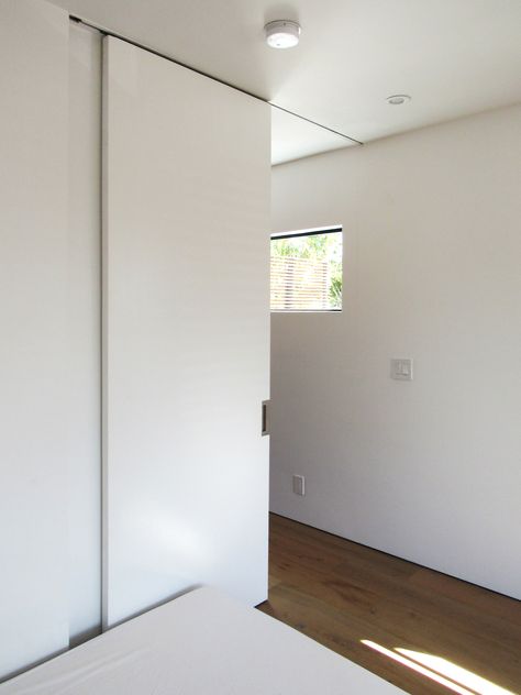 Cavity Sliders Full Height Ceiling Mount Track for a #modern #bedroom door. #cavitysliders #interiordesign #slidingdoor Full Height Pocket Door, Ceiling Track Door, Sliding Door Ceiling Mount, Ceiling Mount Sliding Door, Ceiling Mounted Sliding Door, Slide Door Bathroom, Ceiling Sliding Door, Modern Closet Door, Sliding Bedroom Door