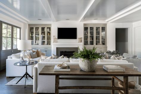 Beach House Fireplace, Sophisticated Coastal, Eric Olsen, House Fireplace, Nook Table, Becki Owens, Fireplace Surround, White Subway Tile, Low Cabinet