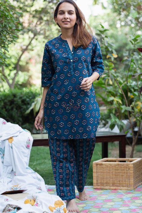 Tailored out of one of the softest weaves of 100% premium cotton, mahabala promises the coziest, breathable comfort as you lounge snooze. The teal bue is adorned with intricate print in contrasting cream and front buttons adds to the stylish charm of the outfit. The round-neckline.While the 2 pockets on the pajamas add to the functionality of this piece. A perfect wear for your traveling comfort wear too. Pajama Design For Kurti, Festive Cotton Designer Wear Sets, Cotton Straight Kurta For Loungewear, Casual Cotton Sets With Printed Motifs, Cotton Loungewear Indian, Co Ords Outfits Indian, Traditional Printed Sleepwear For Loungewear, Nice Suits, Night Suit For Women