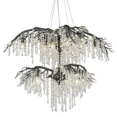 Like dewdrops under a forest canopy, the Autumn Twilight collection displays glistening glass beads that cascade from organic leaves and branches. A modern nod to nature, this collection is a natural in contemporary settings. Candelabra bulbs provide an inner source of illumination that causes the light to sparkle and reflect playfully off the countless gleaming surfaces sparking both curiosity and conversation. This 2-tier 18-light chandelier is large enough to hang in a great room, foyer, or d Contemporary Crystal Chandelier, Branch Chandelier, Leaves And Branches, Forest Canopy, Golden Lighting, Elegant Chandeliers, Farmhouse Chandelier, Contemporary Chandelier, Organic Style