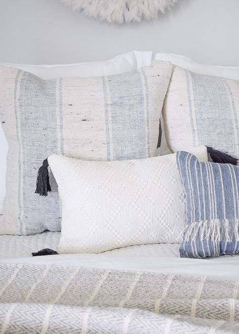 4 Subtle Ways To Add Coastal Decor To Your Home Coastal Pillow Combinations, Coastal Couch Pillows, Coastal Pillows On Sofa, Coastal Couches, Coastal Bedding Ideas, Charleston Apartment, Nomad House, Coastal Cushions, Mom Bedroom