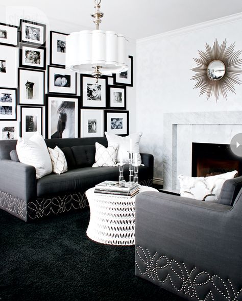 Hollywood drama /   Black-and-white has never looked so decadent. Inspired by a tuxedo, this living room seduced us with its old Hollywood glamour from the crisp white walls to the luxe black carpet to the glitzy nailhead details and lighting fixture. Hollywood Glamour Decor, Glamour Living Room Decor, Black And White Living Room Decor, White Living Room Decor, Glamourous Bedroom, Best Leather Sofa, Dark Carpet, Glamour Decor, Black And White Living Room