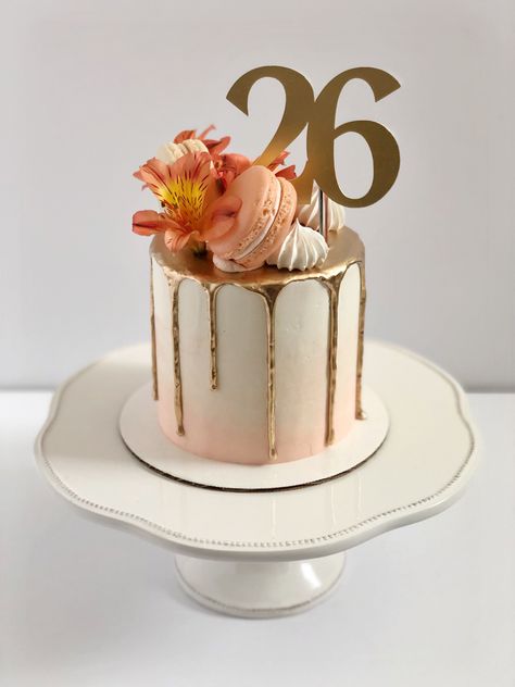 Peach to white gradient cake. Gold drip. Macarons, flowers, and meringues on top in a crescent arrangement. Gold topper reads “26”. Cute 26th Birthday Cake, Peach Colour Birthday Cake, Cake For 27th Birthday, Peach Colored Cake Ideas, Birthday Cake 26th Birthday Girl, 26 Th Birthday Cake, 27th Birthday Cake Ideas For Women, Cake 26 Birthday Woman, 26th Birthday Cakes