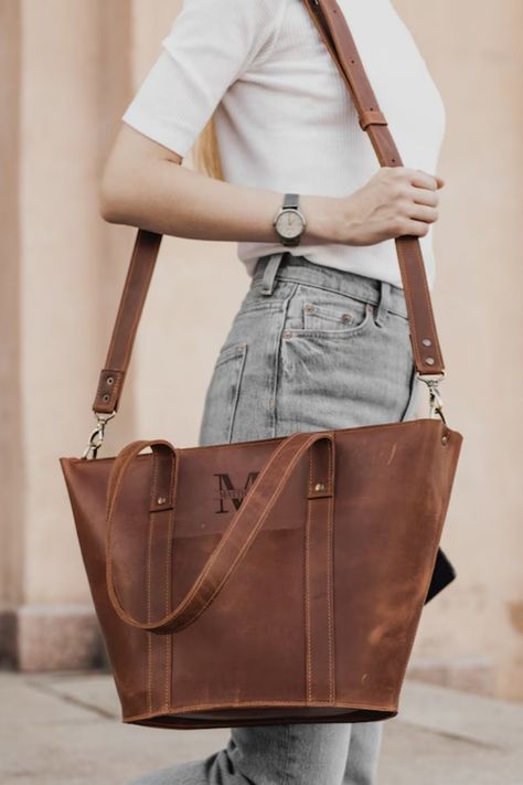 Elevate your style with our custom leather tote bag for women, meticulously handcrafted with rustic charm. This woman shoulder bag is perfect for everyday use, whether for shopping, work, or any adventure, and can be personalized with engraving for a unique touch. Handcrafted Rustic Tote Bag, Custom Leather Bag, Women's Leather Tote, Woman Shoulder Bag, Large Tote, Shopping Bag, Work Bag, Engraved Bag, Artisanal, Personalized Fashion Leather Work Bag Women, Custom Leather Bag, Full Grain Leather Bag, Leather Bag For Women, Leather Work Bag, Womens Messenger Bag, Briefcase Women, Large Leather Tote Bag, Laptop Bag For Women