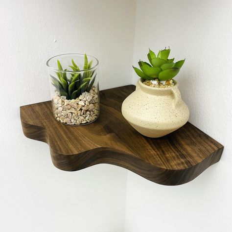 Introducing our new Wavy Corner Shelves, crafted from beautiful walnut wood. With their rustic, wavy design, these shelves are easy to install and look fantastic when you stack two or three together. Perfect for adding a touch of charm to any corner of your home. 🪵 #interior #spring #style #kitchen #aesthetic #neutral #walnut #cornershelves #homedecor #homeinterior Floating Corner Shelf, Floating Corner Shelves, Walnut Shelves, Unique Shelves, Shelving Solutions, Corner Space, Corner Shelf, Coaster Furniture, Wall Plug