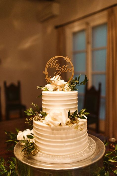 A 2 tier white frosted cake with a Mr. & Mrs. Le topper Engagement Cake Images, Wedding Cake Two Tier, Wedding Cake Designs Elegant, Wedding Cake Simple Elegant, Wedding Reception Cake, White And Gold Wedding Cake, Anniversary Cake Designs, Engagement Party Cake, 50th Wedding Anniversary Cakes