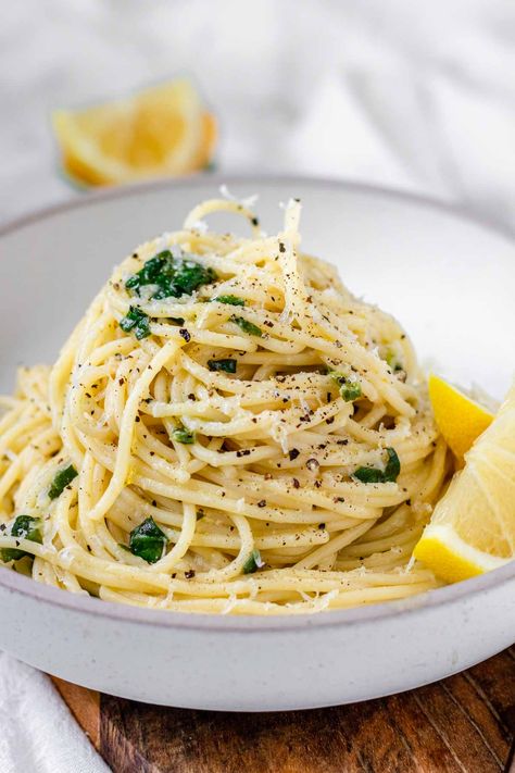 Lemon Pepper Pasta | Delicious and budget friendly, this lemon pepper pasta is bright and zesty, and super easy to make. This 20-minute meal combines comforting pasta with tangy lemon zest and juice, spicy fresh cracked black pepper, and zippy garlic. Add spinach to this easy pasta dinner for some easy added nutrients. Lemon Pepper Spaghetti, Lemon Pepper Pasta Sauce, Lemon Pepper Pasta Recipes, Lemon Pepper Pasta, Roasted Broccoli And Carrots, Seafood Pasta Dishes, Vegetarian Noodles Recipes, Pasta Calories, Lemon Garlic Pasta