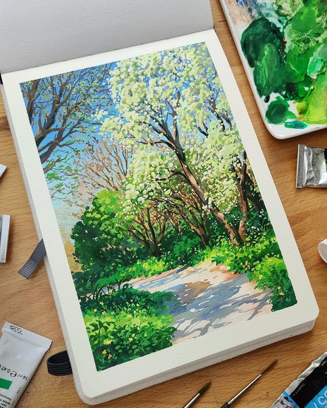 Photo of a sketchbook laid out on a desk surrounded by brushes and gouache paint tubes. The painting shows a pathway through trees and foliage on a sunny spring day. Gouache Painting Techniques, Gouache Landscape, Gouache Tutorial, Dutch Landscape, Paint With Me, Environment Painting, Gouache Illustrations, Posca Art, Twitch Stream