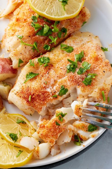 A flaky oven-baked cod that's buttery, and garlicky with a burst of lemon. This refreshing and light main course is perfect for a weeknight dinner. These baked cod fillets will be a family favorite! Cod Fish Recipes Baked Healthy, Old Bay Cod Recipes, Norwegian Cod Recipes, Baked Codfish Recipes, Sole Fillet Recipes Baked Fish, How To Prepare Cod Fish, King Cod Recipes, Baked Cod Recipes Oven Foil, Oven Cooked Fish Recipes