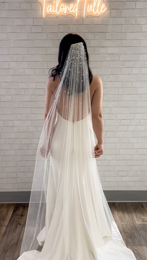 This stunning pearl veil features different sized faux pearls cascading from the crown of the veil down. The pearls are individually hand placed on this veil for a beautiful handmade heirloom piece. The pearls are concentrated at the top of the veil and stop near fingertip length(however adjusted for length, more pearls stop higher for a fingertip length and lower for a cathedral length). The bottom of the veil is plain. This veil would be fabulous paired with a modern crepe minimalist gown. Eac Modern Veil, Floor Length Veil, Minimalist Gown, Beaded Veils, Pearl Veil, Bridal Hair Inspiration, Wedding Veil Accessories, Long Veil, Cathedral Veil