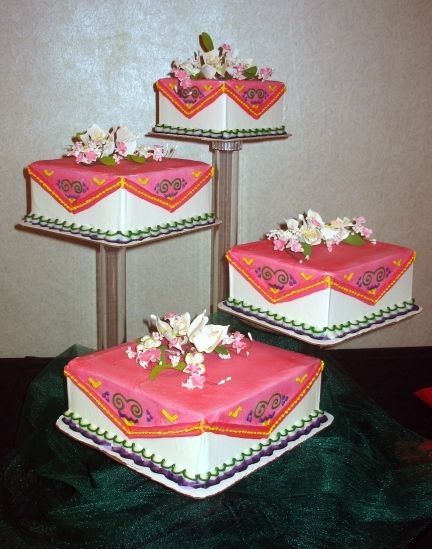 the rich bright colors represent the bright colors of Hmong clothing...gumpaste flowers on top of cakes...airbrushed the cake... Hmong Wedding, Hmong Clothing, Hmong Food, Hmong Fashion, Cake Stand Decor, Incredible Cakes, Square Wedding Cakes, Gumpaste Flowers, Ethnic Wedding