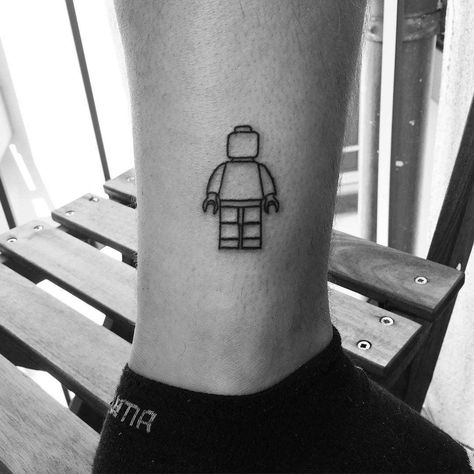 Lego Movie Tattoo, Lego Tattoo Ideas For Men, Lego Batman Tattoo, Lego Man Tattoo, Lego Brick Tattoo, Lego Tattoo, Related Tattoos, Ankle Tattoo Designs, Belly Tattoos