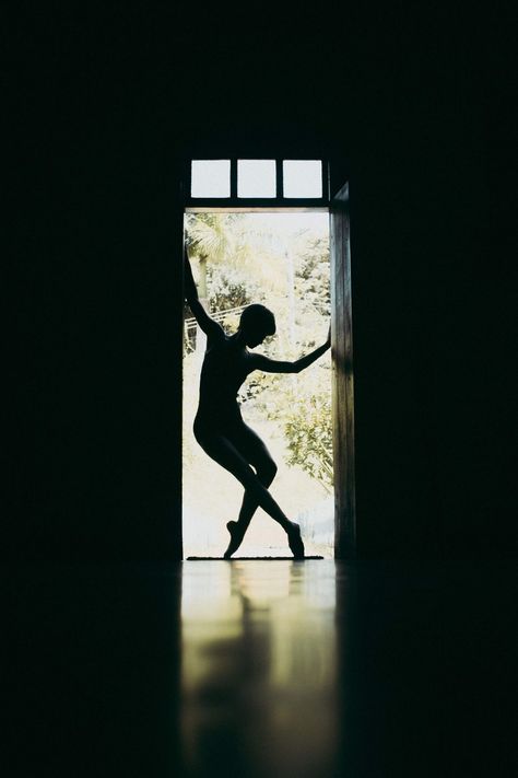 Silhouette of Woman Dancing By The Door · Free Stock Photo Barre At Home, Silhouette Of Woman, Art Ballerina, Growth Motivation, Dance Project, Ballet Poses, Dancers Art, Silhouette Photography, Ballet Barre