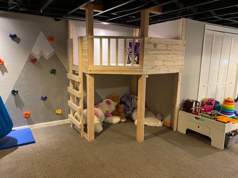 Basement Play Corner, Custom Indoor Playground, Unfinished Basement Toy Room, Playroom Fort Loft, Indoor Loft Playhouse, Loft In Playroom, Diy Indoor Treehouse, Indoor Play Fort, Indoor Jungle Gym Diy