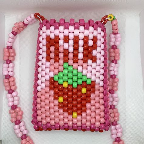 "Strawberry Milk carton crossbody Kandi purse is hand-made 100% from beads on ONE string. Just like you, all of the purses on my shop will always be 1/1.  DIMENSIONS: Bag - 6.5\" tall x 5\" wide  Strap - 48\" long  All items are hand-made on white jewelry string and triple-knotted to ensure the best stretch and durability. As a thank you, every order also includes FREE GIFTS! (Bigger orders = bigger gifts 😊)" Kandi Purse Tutorial, Kandi Wallet, Kandi Backpack, Kandi Bag Pattern, Kandi Purse, Kandi Bag, Strawberry Milk Carton, Rave Bracelets, Kandi Cuff Patterns