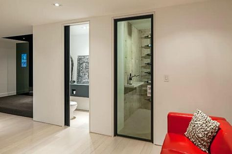 Sleek and sexy modern property in Oakville, Canada No Baseboards, Interior Door Trim Ideas, Modern Baseboards, Interior Door Trim, Modern Basement, Wine Cellar Design, Cellar Design, Modern Properties, Minimalist House Design