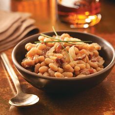 Vermont Baked Beans Recipe -These baked beans are nothing like the canned variety you may be used to. The rich sauce has wonderful smokiness from chopped bacon and a subtle sweetness from maple syrup.—Elizabeth Horton, Brattleboro, Vermont Vermont Recipes, Baked In Vermont, Soak Beans, Brattleboro Vermont, Baked Beans Recipe, Baked Bean Recipes, State Foods, Side Dishes Recipes, Beans Recipe