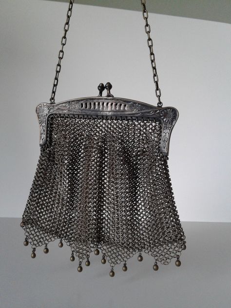 Vintage Chain purse with gorgeous detail. Top portion is marked G SILVER.  Top portion has beautiful flower and leaf design. All chain pieces are intact. Bottom has 4 triangular shaped drops with beaded accents. One bead is missing from the far side. Purse measures about 5"x5". Chain has 8" drop. Gorgeous  piece. I'll  let you shine it. Thanks for looking. Chainmail Bag, Chainmail Purse, Knight Core, Side Purse, Vinyl Display, Far Side, Chain Purse, Silver Bags, Vintage Chain