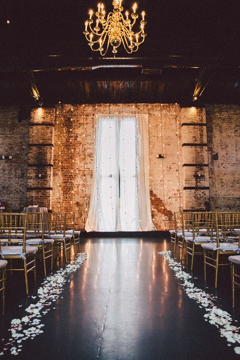 With tall brick walls and exposed beam ceilings, the ceremony and reception venue was the perfect location based on its beautiful interior alone. | Speakeasy Themed Industrial Wedding | Zorz Studios Loft Wedding Reception, Industrial Wedding Ceremony, Loft Wedding Ceremony, Industrial Wedding Decor, Urban Wedding Venue, Loft Wedding, Wedding Ceremony Backdrop, Urban Wedding, Salou