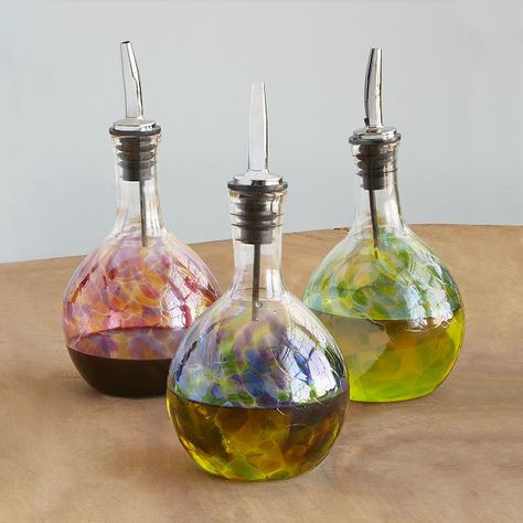 A handblown glass oil pourer, because nothing ruins a fancy kitchen's aesthetic like plastic bottles with tacky labels. Helpful Gadgets, Oil And Vinegar Bottles, Oil Pourer, Unique Hostess Gifts, Fancy Kitchens, How To Make Oil, Olive Oil Dispenser, Uncommon Goods, Best Gifts For Mom