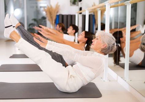 Elderly woman doing pilates in gym royalty free stock photo Pilates Photos, Pilates Exercises, Elderly Woman, Mat Pilates, Pilates Workout, Athletic Women, Yoga Fitness, Gym Workouts, Pilates